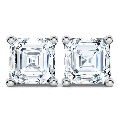 Pair of diamond stud earrings on a white background